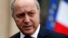 French Minister of Foreign Affairs Laurent Fabius leaves after the weekly cabinet meeting at the Elysee Palace in Paris, Feb. 19, 2014. 