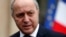 French Minister of Foreign Affairs Laurent Fabius leaves after the weekly cabinet meeting at the Elysee Palace in Paris, Feb. 19, 2014. 