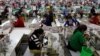 In this file photo taken on Dec. 12, 2018, employees work at a factory supplier of the H&M brand in Kandal province, Cambodia.
