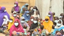 Wives of Boko Haram fighters and their children are seen at the DDR Center in Meri, Cameroon, July 29, 2021. (Moki Edwin Kindzeka/VOA)
