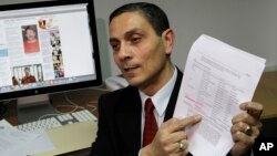 FILE - Richard Chichakli talks to a reporter in Moscow after being accused of offenses linked to alleged arms trafficking, Feb. 19, 2010.