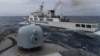 Kapal Garda Pantai China tampak dari kapal TNI AL saat patroli di Zona Ekonomi Eksklusif Indonesia di utara Pulau Natuna, 11 Januari 2020. (Foto: Risyal Hidayat/Antara via Reuters)
