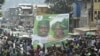 Supporters of the opposition Sierra Leone People's Party (SLPP) march through central Freetown with a placard of presidential candidate Julius Maada Bio and his running mate, Dr. Kadi Sesay, in Freetown, Sierra Leone, October 19, 2012. 