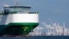 FILE - A cargo ship passes the Port of Baltimore in Baltimore, Oct. 14, 2021.