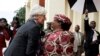 FILE - International Monetary Fund Managing Director Christine Lagarde is greeted by Malawi’s President, Joyce Banda, on arrival at Kamuzu Palace in Lilongwe on her three day official visit to Malawi, Jan. 4, 2013.