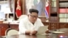 North Korean leader Kim Jong Un reads a letter from U.S. President Donald Trump, in Pyongyang, North Korea, in this picture released by North Korea's Korean Central News Agency, June 22, 2019.