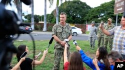 U.S. Navy Rear Adm. Robb Chadwick speaks to the media at the main gate at Joint Base Pearl Harbor-Hickam, Dec. 4, 2019, in Hawaii, following a shooting. 