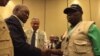 Former Nigerian President Olusegun Obasanj, right, greets former Zambian President Rupiah Banda after a news conference held by Commonwealth Observers team in Kampala, Feb. 20, 2016. Obasanjo heads Commonwealth Observers and Banda heads the Electoral Inst