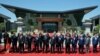 Leaders attending the Belt and Road Forum wave as they pose for a group photo at the Yanqi Lake venue on the outskirt of Beijing, China, May 15, 2017. 