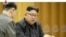 FILE - This image made from undated video of a news bulletin aired by North Korea's KRT on Sept. 3, 2017, North Korea's leader Kim Jong Un holds the Presidium of the Political Bureau of the Central Committee. 