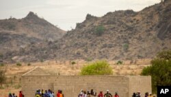 FILE - Villagers are seen gathered in Maroua, northern Cameroon, April 18, 2016. Boko Haram militants have again been stepping up attacks in the northern part of the country in recent months. 