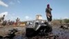 Somali security forces attend the scene after an attack on a European Union military convoy in the capital Mogadishu, Somalia, Oct. 1, 2018.