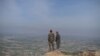 FILE - Afghan National Army (ANA) soldiers keep watch in Dand-e-Ghori district in Baghlan province on March 15, 2016, following weeks of heavy battles to recapture the area from Taliban militants.
