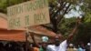 Supporters of Guinea's opposition hold a banner reading "Transparente Elections. Sign of Peace" during an opposition rally in Conakry (file)