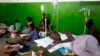 Victims of cholera receive treatment at a cholera center in Anse D'Hainault, Haiti, Oct. 11, 2016. The U.N. said Hurricane Matthew has increased the risk of a "renewed spike" in the number of cholera cases. 