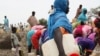 At the Jamam refugee camp, shows people gathering water in South Sudan's Upper Nile state, where over 100,000 refugees have fled conflict in Sudan's Blue Nile state since September, June 15, 2012.