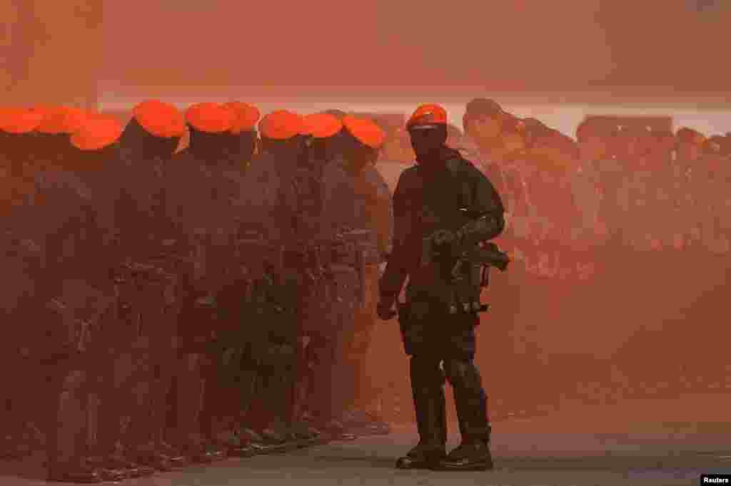 Police and military special forces are seen during an anti-terror drill ahead of the upcoming Asian Games in Jakarta, Indonesia.