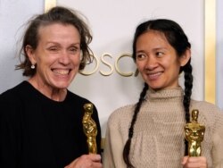 Producers Frances McDormand, left, and Chloe Zhao, winners of the award for best picture for "Nomadland," pose in the press room at the Oscars on Sunday, April 25, 2021, at Union Station in Los Angeles. (AP Photo/Chris Pizzello, Pool)