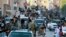 FILE - Fighters from the Islamic State group parade in Raqqa, north Syria, June 30, 2014. Islamic State militants are cracking down on the few remaining Christians and preventing them from leaving Raqqa, Syria, local activists told VOA on April 5, 2016.