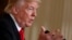 FILE - President Donald Trump speaks in the East Room of the White House in Washington. 