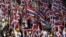 Protesters against the government-backed amnesty bill hold Thai national flags as they march in central Bangkok November 14, 2013.