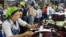 Cambodian garment workers work inside a factory in Phnom Penh, Cambodia, file photo. 