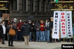 Protestors link arms at the top an alley with an encampment, where students are protesting in support of Palestinians at Emerson College in Boston, Massachusetts, U.S., April 24, 2024. (REUTERS/Brian Snyder)