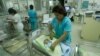 FILE - Nurses attend newborn babies at the Maternity hospital in Lima, Peru.