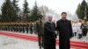 Chinese President Xi Jinping, center right, shakes hands with Iranian President Hassan Rouhani, as they pose for a photograph in an official arrival ceremony, at the Saadabad Palace in Tehran, Iran, Jan. 23, 2016. 