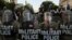 FILE - D.C. National Guard Military Police officers and law enforcement officers stand guard during a protest against the death in Minneapolis custody of George Floyd, near the White House in Washington, June 1, 2020.