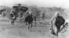 Back in action, U.S. Marines run from GH53 helicopter that landed them on Koh Tang island 30 miles off Cambodia in the rescue of U.S. merchant ship Mayaguez, May 15, 1975. (AP Photo)