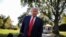 FILE - U.S. President Donald Trump talks to reporters as he departs for campaign travel to Ohio from the South Lawn at the White House in Washington, Sept. 21, 2020.