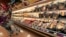 FILE - A customer checks out the ready made food section at a grocery store in Cincinnati, Ohio.