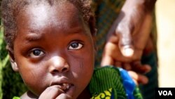 Omema survived lead poisoning but her caretakers say she can't hear or speak and is constantly sickly. Parents say they can't count the number of children that have been killed by lead poisoning in recent years. (H. Murdock for VOA)