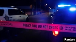 Chicago police crime scene tape marks the crime scene of a shooting of two men at the South Side of Chicago, Illinois, July 25, 2020.
