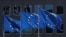 FILE - European Union flags flutter outside the European Commission headquarters in Brussels, Belgium, June 25, 2020. 