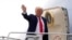 US President Donald Trump waves as he boards Air Force One en route to Florida at Harry Reid International Airport in Las Vegas, Jan. 25, 2025. 