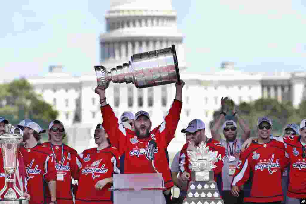 Washington Capitals&#39; Alex Ovechkin of Russia holds up the Stanley Cup trophy during the NHL hockey team&#39;s Stanley Cup victory celebration at the National Mall in Washington.
