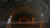 A policeman stands guard at the Zojila tunnel under construction which connects Srinagar, Kashmir, to the Indian union territory of Ladakh bordering China.
