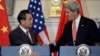 John Kerry and Wang Yi shake hands after making statements before bilateral meeting. Sept. 19, 2013. 