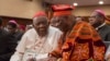FILE - Cardinal Christian Wiyghan Tumi (L) talks with Cameroonian veteran opposition leader John Fru Ndi as they attends at the Congress Palace during the opening session of the National Dialogue called by President Biya, in Yaounde, Sept. 30, 2019.