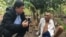 VOA Khmer reporter Sok Khemara​ interviews Ao An in Battambang province's Kamrieng district in mid-December 15, 2019. (Hul Reaksmey/VOA Khmer) ​​ 