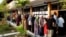 People line up to vote during the general election in Alor Setar, Malaysia, May 9, 2018. By 1 p.m. about 55 percent of the eligible voters had cast ballots.