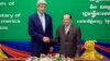 U.S. Secretary of State John Kerry, left, shakes hands with Cambodian Foreign Minister and Deputy Prime Minister Hor Namhong before a bilateral meeting at the Ministry of Foreign Affairs in Phnom Penh, Cambodia, Jan. 26, 2016.