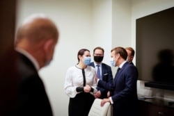 FILE - Belarusian opposition leader Sviatlana Tsikhanouskaya meets with French President Emmanuel Macron in Vilnius, Lithuania, Sept. 29, 2020.