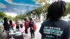 FILE - people gather around the Ben & Jerry's "Yes on 4" truck as they learn about Amendment 4 and eat free ice cream at Charles Hadley Park in Miami. 