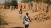Children run home from school after hearing gunfire and explosions in Gao, February 21, 2013.