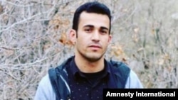 Iranian Kurdish dissident Ramin Hossein Panahi is seen in this undated image shared by human rights activists online. 