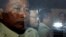 Ny Chakrya, second from left, former ADHOC and a National Election Committee member who worked at the organization, sits in a car and is transported back to an Anti-Corruption Unit, ACU, after a short appearance at Phnom Penh Municipal Court, in Phnom Penh, Cambodia, Saturday, April 30, 2016. Cambodian authorities arrested five human rights workers last Friday on accusations they tried to help cover up a woman's affair with the deputy leader of the opposition Cambodia National Rescue Party. The action is the latest in a series by Prime Minister Hun Sen's government putting legal pressure on its critics and political opponents. (AP Photo/Heng Sinith)