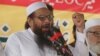 FILE - Hafiz Saeed, leader of Jamaat-ud-Dawa address an anti-Indian rally in Lahore, Pakistan. 